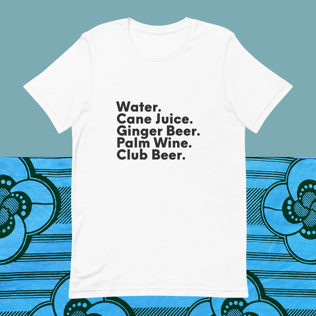 One black shirt with white text that reads "Pepper. Roasted Fish. Palm. Wine. BreadfA white shirt with black text on its right that reads "Water. Cane Juice. Ginger Beer. Palm Wine. Club Beer." on a blue background.